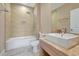 Bathroom with tub, toilet and modern vanity at 3112 Rockefeller Way, Kissimmee, FL 34747
