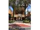 Community entrance with covered walkway and lush landscaping at 12521 Floridays Resort Dr # 302F, Orlando, FL 32821