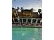 Resort-style pool with lounge chairs and water feature at 12521 Floridays Resort Dr # 302F, Orlando, FL 32821