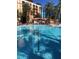 Large swimming pool with palm trees at 12521 Floridays Resort Dr # 302F, Orlando, FL 32821