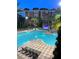 Aerial view of resort-style pool and building at 12521 Floridays Resort Dr # 302F, Orlando, FL 32821