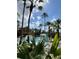Refreshing pool area with palm trees at 12521 Floridays Resort Dr # 302F, Orlando, FL 32821