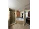 Bathroom with corner jacuzzi tub, shower, and bedroom view at 12521 Floridays Resort Dr # 302F, Orlando, FL 32821