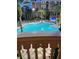 Resort-style pool with lounge chairs at dusk at 12521 Floridays Resort Dr # 302F, Orlando, FL 32821