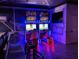 Two racing arcade games with vibrant lighting at 7411 Gathering Ct, Reunion, FL 34747