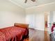 Bedroom with hardwood floors, double door closet and additional space at 16300 Johns Lake Rd, Clermont, FL 34711