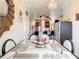 Spacious dining area with a glass top table and modern chairs at 16300 Johns Lake Rd, Clermont, FL 34711