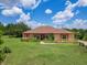 Charming single-story home with a landscaped yard and beautiful curb appeal at 16300 Johns Lake Rd, Clermont, FL 34711