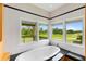 Bathroom with freestanding tub and golf course views at 917 Desert Mountain Ct, Reunion, FL 34747