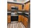 Kitchen boasts stainless steel appliances and wood cabinets at 824 Camargo Way # 106, Altamonte Springs, FL 32714