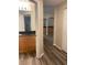Bathroom with dark wood cabinets and granite countertop at 824 Camargo Way # 106, Altamonte Springs, FL 32714