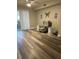 Living room featuring vinyl flooring and stylish armchair at 824 Camargo Way # 106, Altamonte Springs, FL 32714
