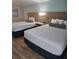 Hotel bedroom with two double beds at 3000 Maingate Ln # 317, Kissimmee, FL 34747