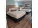 Hotel bedroom with two double beds at 3000 Maingate Ln # 317, Kissimmee, FL 34747
