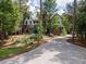 Long driveway leading to a unique blue and white two-story home at 13857 Marine Dr, Orlando, FL 32832