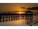 Serene lakeside dock at sunset at 13857 Marine Dr, Orlando, FL 32832