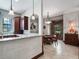 Kitchen with an island and a view into the dining room at 13857 Marine Dr, Orlando, FL 32832