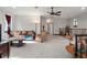 Bright bonus room featuring a leather sofa and armchairs, providing a relaxing atmosphere at 13857 Marine Dr, Orlando, FL 32832