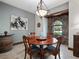 Formal dining room with a stone accent wall at 13857 Marine Dr, Orlando, FL 32832