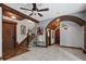 Spacious living room with high ceilings, exposed beams, and a view of the kitchen at 13857 Marine Dr, Orlando, FL 32832