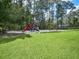 Community playground with swings and slides at 13857 Marine Dr, Orlando, FL 32832