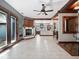 Open living room with a corner fireplace, hardwood floors and French doors at 13857 Marine Dr, Orlando, FL 32832