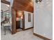 Elegant entry hall with decorative iron gate and wood staircase at 13857 Marine Dr, Orlando, FL 32832