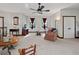 Upstairs bonus room with carpeted floor, seating area and large windows at 13857 Marine Dr, Orlando, FL 32832