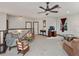 Spacious bonus room with carpeted floor, comfortable seating, and plenty of natural light at 13857 Marine Dr, Orlando, FL 32832