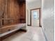 Inviting entryway with built-in bench and stained glass door at 13857 Marine Dr, Orlando, FL 32832