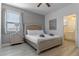 King bed, nightstands, and en-suite bath access at 6032 Broad Oak Dr, Davenport, FL 33837