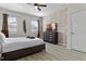 Bedroom with king-size bed, dresser, and large window at 6032 Broad Oak Dr, Davenport, FL 33837