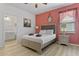 Queen bed, nightstand, and en-suite bathroom at 6032 Broad Oak Dr, Davenport, FL 33837
