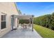 Covered patio with table and chairs, surrounded by greenery at 2570 Amaya Ter, Lake Mary, FL 32746