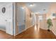 Bright hallway with light wood floors and neutral walls at 2570 Amaya Ter, Lake Mary, FL 32746