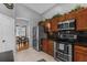 Modern kitchen with stainless steel appliances and wood cabinetry at 2570 Amaya Ter, Lake Mary, FL 32746
