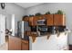 Kitchen boasts granite countertops, wood cabinets, and a breakfast bar at 2570 Amaya Ter, Lake Mary, FL 32746