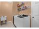 Convenient laundry room with washer, dryer, and shelving at 2570 Amaya Ter, Lake Mary, FL 32746