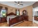 Large main bedroom with wood furniture and an ensuite bathroom at 2570 Amaya Ter, Lake Mary, FL 32746