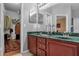 Double vanity bathroom with a walk-in closet at 2570 Amaya Ter, Lake Mary, FL 32746