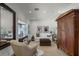 Bright sitting room features a comfortable sofa, large mirror, and antique armoire at 421 Lakewood Dr, Winter Park, FL 32789