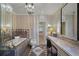 Large bathroom with a soaking tub, walk-in shower, and vanity at 421 Lakewood Dr, Winter Park, FL 32789