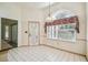 Bright dining area with an arched window and decorative curtain at 11511 Sw 72Nd Cir, Ocala, FL 34476