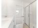 Clean bathroom with double vanity and a walk-in shower at 5953 Catamaran Ave, Haines City, FL 33844