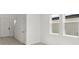 Clean entryway with light flooring and white doors at 5953 Catamaran Ave, Haines City, FL 33844
