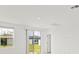 Bright living room with sliding glass doors leading to backyard at 5953 Catamaran Ave, Haines City, FL 33844