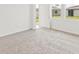 Bright bedroom featuring carpet and access to the backyard at 5953 Catamaran Ave, Haines City, FL 33844