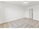 Well-lit bedroom with grey carpet and ample space at 5953 Catamaran Ave, Haines City, FL 33844