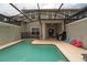 Private screened-in pool with lounge chairs and patio furniture at 4803 Brier Rose Ln, Kissimmee, FL 34746