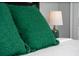 Green pillows and a lamp on a bed in a bedroom at 4803 Brier Rose Ln, Kissimmee, FL 34746